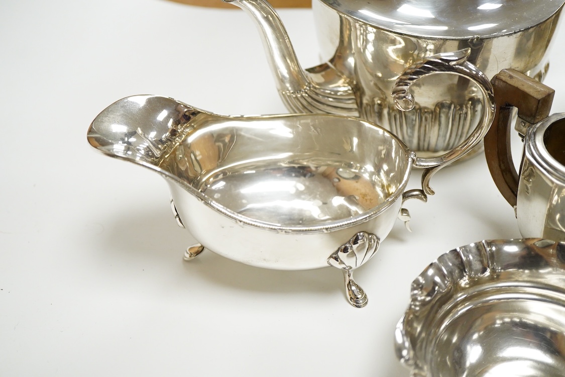 A 20th century continental 800 standard white metal hot water pot and cream jug (lacking cover and knop), gross weight 11.2oz, together with a plated teapot, sauceboat and bowl.